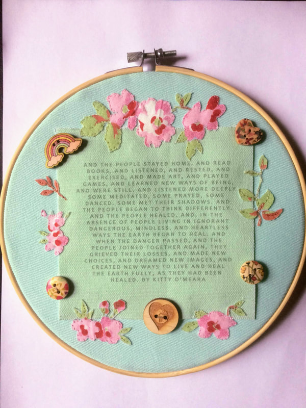 Applique wall décor: poem by Kitty O'Meara 'And the People Stayed Home'. Décor features floral material and wooden buttons of rainbow, Earth 